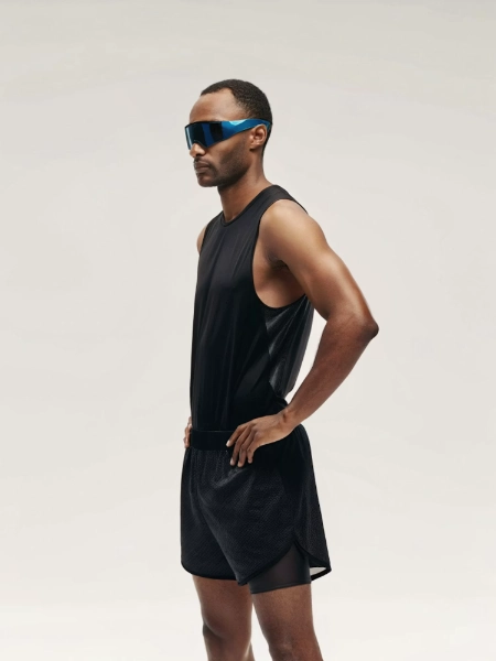 Man in black athletic wear and blue sunglasses
